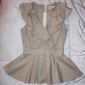 Sleeveless tan and white pin stripe top.